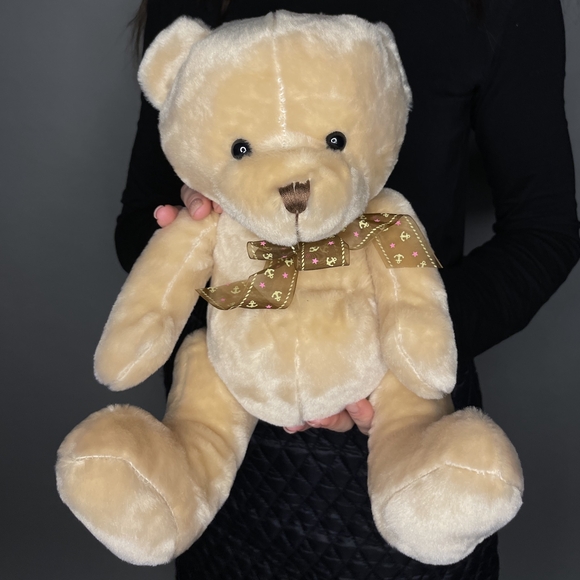 Игрушка медведь с бантом бежевый 25 см