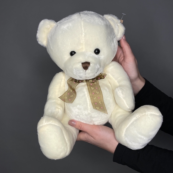 Игрушка медведь с бантом кремовый 25 см